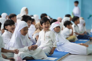 Senyum ceria seorang siswa dalam rangkaian kegiatan Ifthar Jama'i dan Pesantren Ramadan